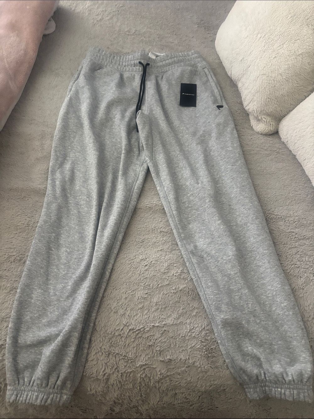 Men’s Fabletics sweatpants with adjustable waistband.